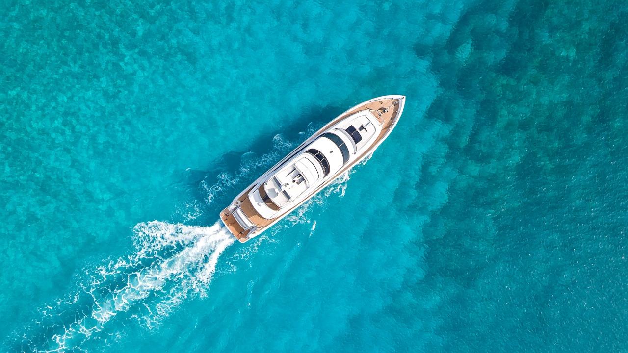 Aerial view of yacht in turquoise water